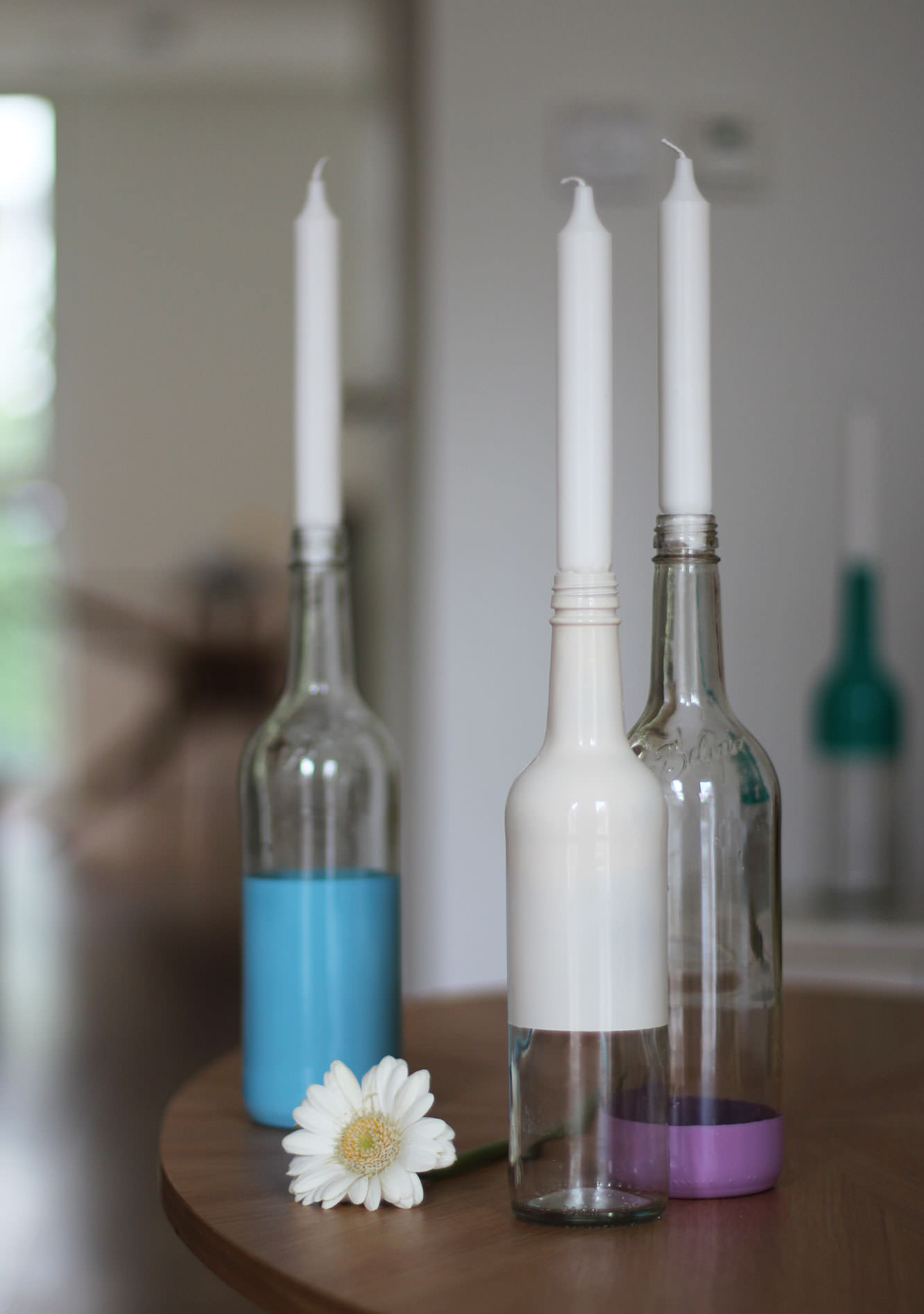 spray-paint-bottle-candle-holders-diy-7